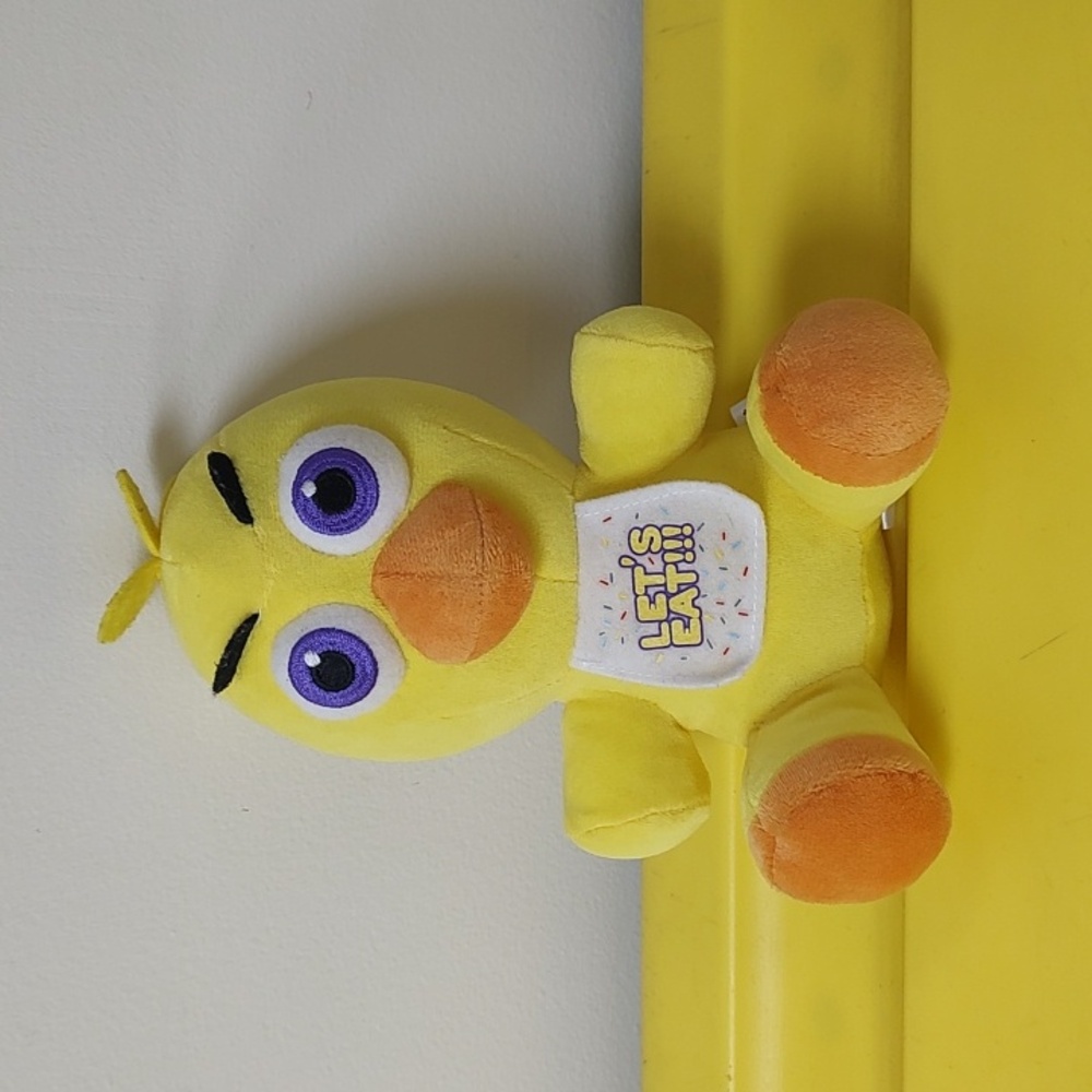 Yellow Plush Toy with Orange Accents